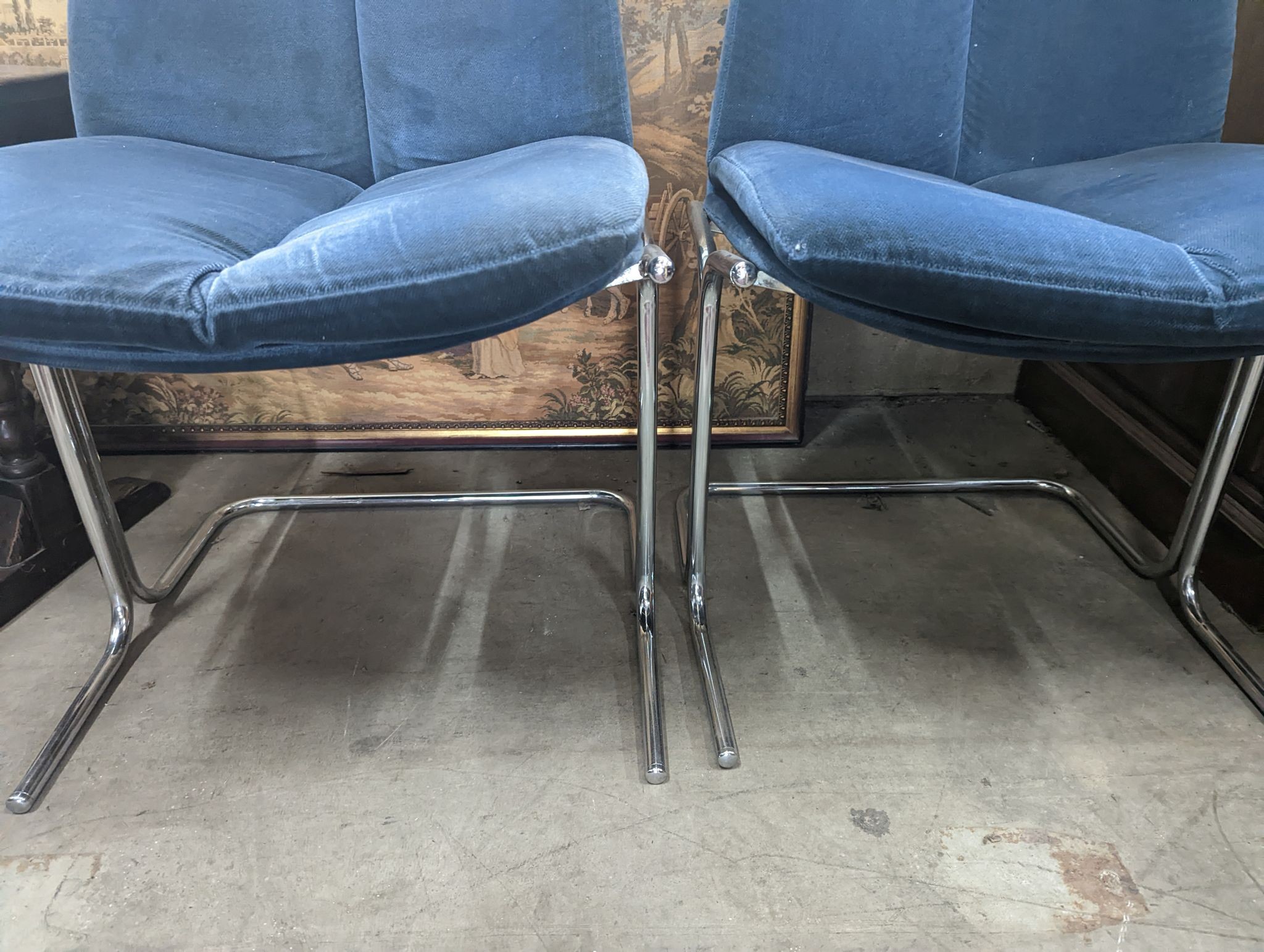 A pair of mid century blue fabric dining chairs
